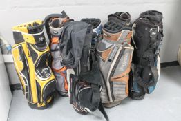Eight golf bags : Ping, Titleist,