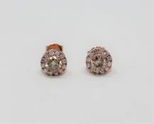 A pair of 14ct rose gold diamond cluster earrings,