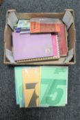 A box of stamp albums and stamp related booklets