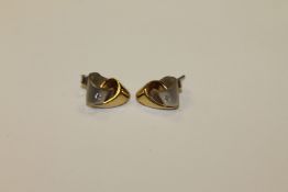 A pair of two-tone 18ct gold diamond set earrings (2)
