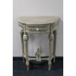 A reproduction demi lune hall table