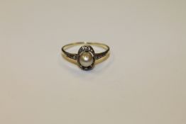 A 14ct yellow gold natural pearl and diamond ring, size N.