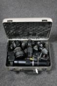 A camera case containing Nikon D300, Nikon D3100, Nikon 120mm macro lens, 450mm lens,