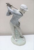 A Lladro figure of a golfer CONDITION REPORT: In good condition.