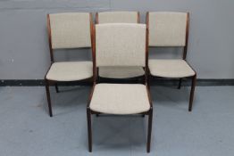 A set of four mid century Danish dining chairs in beige upholstery