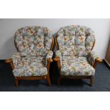 A pair of late 20th century wingback armchairs in floral fabric