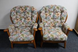 A pair of late 20th century wingback armchairs in floral fabric