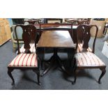 An inlaid mahogany drop leaf table and four dining chairs