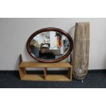 A pine wall shelf, oval shaped mirror,