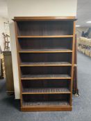 A set of antique mahogany open book shelves