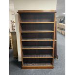 A set of antique mahogany open book shelves