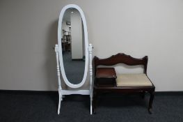 A painted cheval mirror and a telephone table