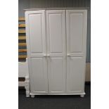 A painted pine triple door wardrobe