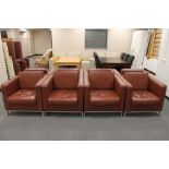 Four contemporary brown leather look armchairs
