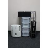 A Delonghi slim de-humidifier, leather CD rack, metal pan stand,