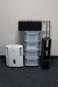 A Delonghi slim de-humidifier, leather CD rack, metal pan stand,