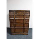 A mid 20th century oak five drawer chest