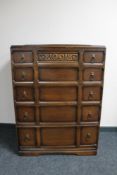 A mid 20th century oak five drawer chest