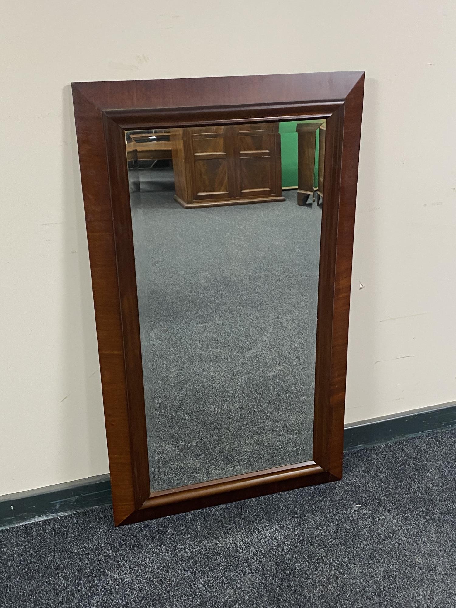 An antique mahogany framed wall mirror