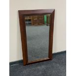 An antique mahogany framed wall mirror