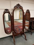 A reproduction mahogany cheval triple mirror, height 181 cm.