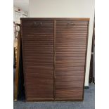 A 20th century double shutter door office cabinet