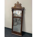 A late 19th century inlaid mahogany hall mirror