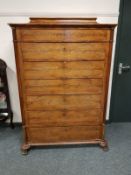 A Continental mahogany seven drawer chest on paw feet, width 107 cm.