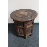 A carved folding Eastern hardwood table with bone inlay CONDITION REPORT: Small loss
