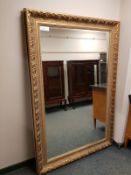 An ornate Victorian style gilt framed overmantel mirror,