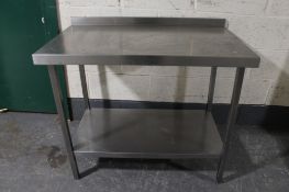 A stainless steel two tier prep table