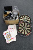 Two boxes of oversized playing cards, two dart boards, pub glasses,