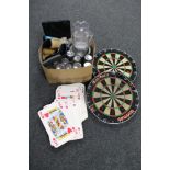 Two boxes of oversized playing cards, two dart boards, pub glasses,