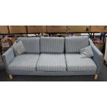 A 20th century Friis Danish three seater settee in blue striped fabric