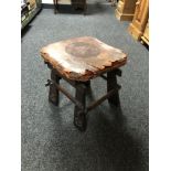 An Arts and Crafts leather seated stool
