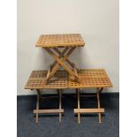 A folding teak hardwood table and two others