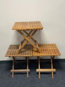 A folding teak hardwood table and two others