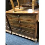 A 19th century mahogany four drawer chest on paw feet