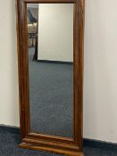 A late 19th century continental walnut hall mirror