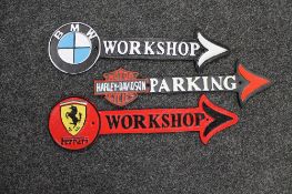 Three cast iron arrows - BMW workshop,
