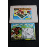 A Palitoy Horse of the Year showing jumping board game and a vintage Britons model riding school in