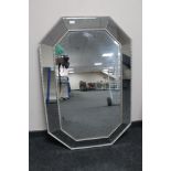 A contemporary all glass cushion mirror