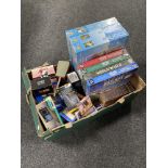 A box of DVD box sets, jigsaws, vintage electrical items,