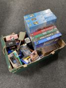 A box of DVD box sets, jigsaws, vintage electrical items,