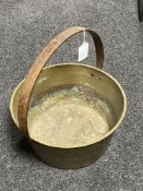 An antique brass jam pan