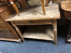 A 20th century oak side table fitted a drawer