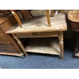 A 20th century oak side table fitted a drawer