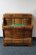 A continental inlaid mahogany barrel fronted bureau