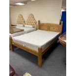A Mexican pine 4'6" bed frame with mattress