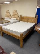 A Mexican pine 4'6" bed frame with mattress